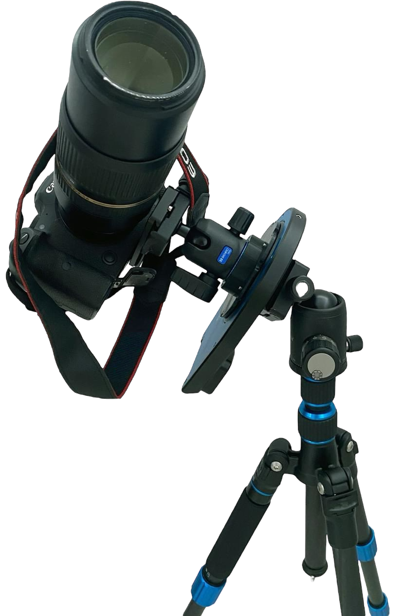 Astrophotography setup showing a DSLR camera with telephoto lens mounted on the Pegasus Astro Falcon Rotator v2 and tripod against a transparent background