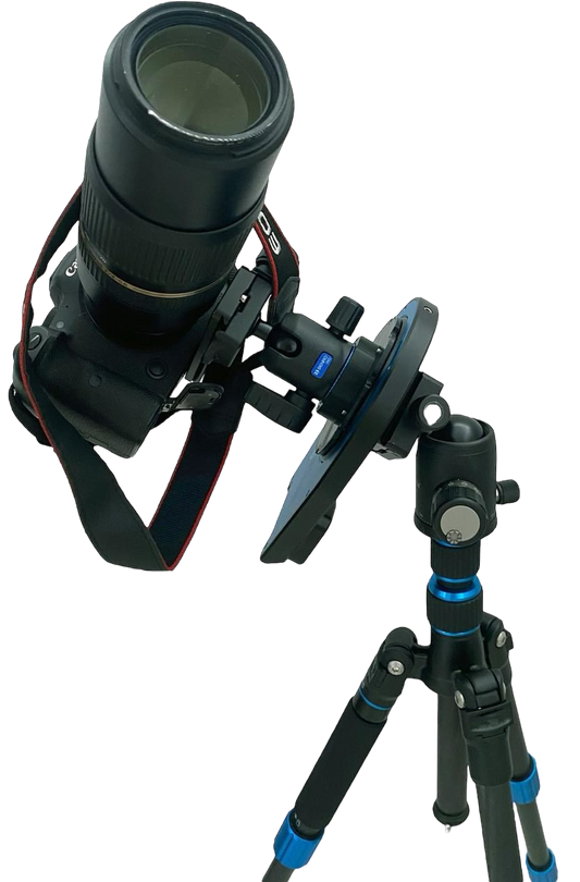Astrophotography setup showing a DSLR camera with telephoto lens mounted on the Pegasus Astro Falcon Rotator v2 and tripod against a transparent background