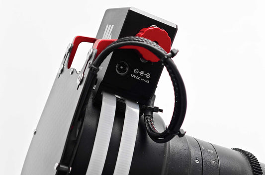 Close-up of the WandererCover V4-EC IR control module and motor assembly mounted on a telescope
